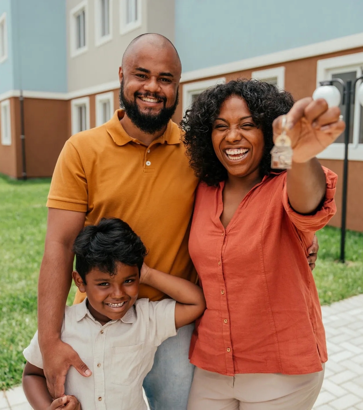 Family receiving keys to their new home